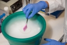 researcher using ice bucket in lab