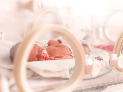 newborn in incubator