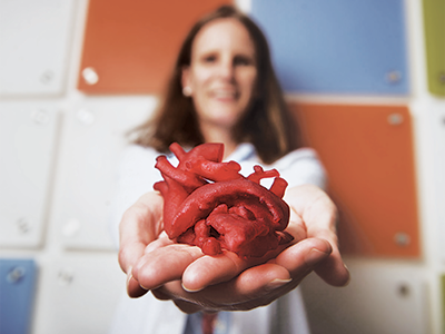 Dr. Laura Olivieri holding a 3D printed heart