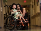 child in wheelchair with mom