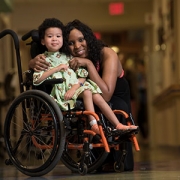 child in wheelchair with mom