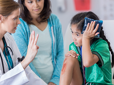 little girl with concussion at doctors