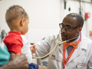 Dr. Andrew Campbell examines a child