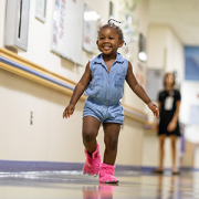 little girl in hosptial corridor