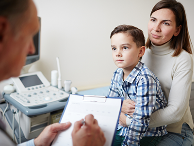 boy and his mom at the doctors