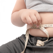 child measuring his stomach