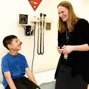 Dr. Bornhorst talks with her patient Maddox Gibson,