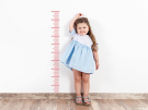 little girl measuring her height
