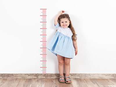 little girl measuring her height