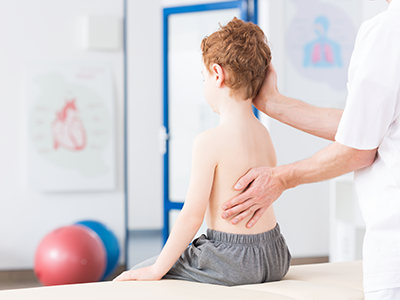 Boy with scoliosis during rehabilitation