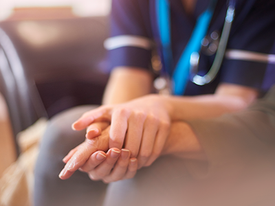 Nurse comforting patient