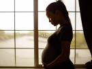 pregnant woman by window
