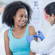 girl getting a vaccine