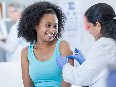 girl getting a vaccine