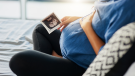 pregnant woman looking at sonogram