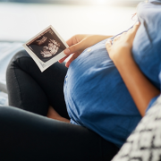 pregnant woman looking at sonogram