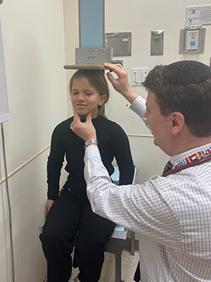 Dr. Andrew Dauber measures Mia's height