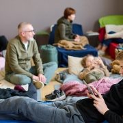 boy on cot in emergency shelter