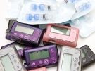 photograph of a pile of insulin pumps