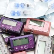 photograph of a pile of insulin pumps