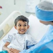 Smiling boy in hospital bed