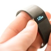 close up of a Fitbit in a person's hand
