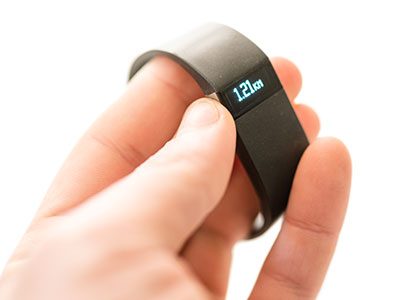 close up of a Fitbit in a person's hand