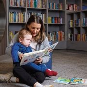 Child Life Specialist Lanie Berk reads to Jack in our Family Resource Center