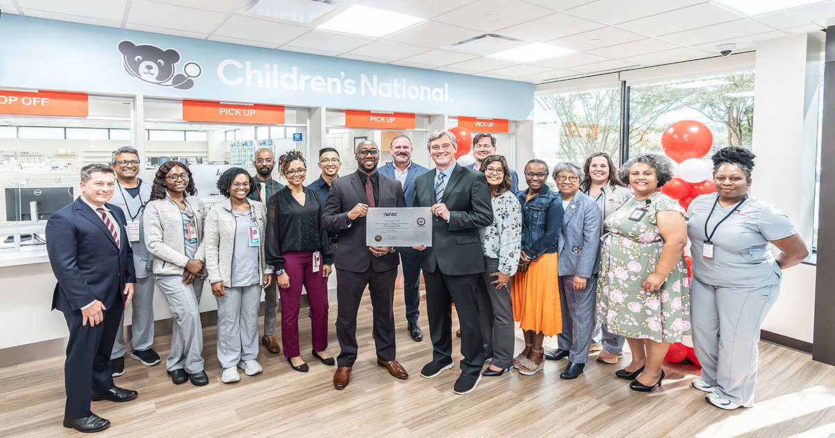 Pharmacy team receiving URAC award