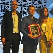 Dr. Marius George Linguraru accepts the IEEE EMBS Distinguished Service Award.