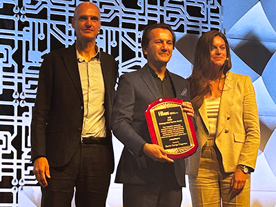 Dr. Marius George Linguraru accepts the IEEE EMBS Distinguished Service Award.