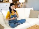 woman meditating on a couch