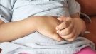 girl holding her stomach