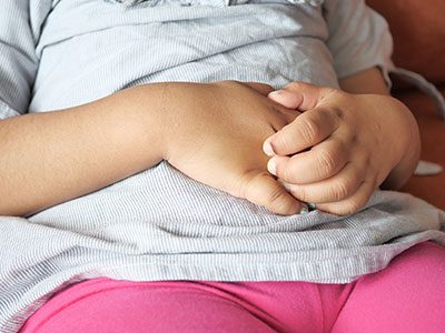 girl holding her stomach