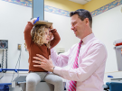 Dr. Dauber measures a patient's height