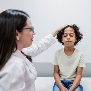 boy with concussion being examined by a doctor