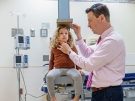 Dr. Dauber measuring a patient's height
