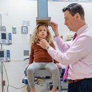 Dr. Dauber measuring a patient's height