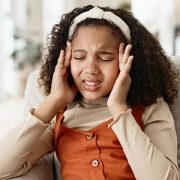 girl experiencing a headache
