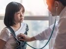 doctor listening to girl's heart