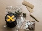 Marijuana buds, grinder, joint, rolling papers for smoking