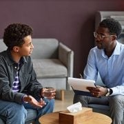 teen boy talking to psychiatrist